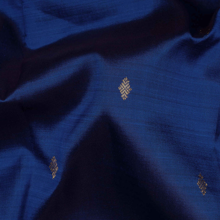 Close-up of blue fabric with gold embroidery