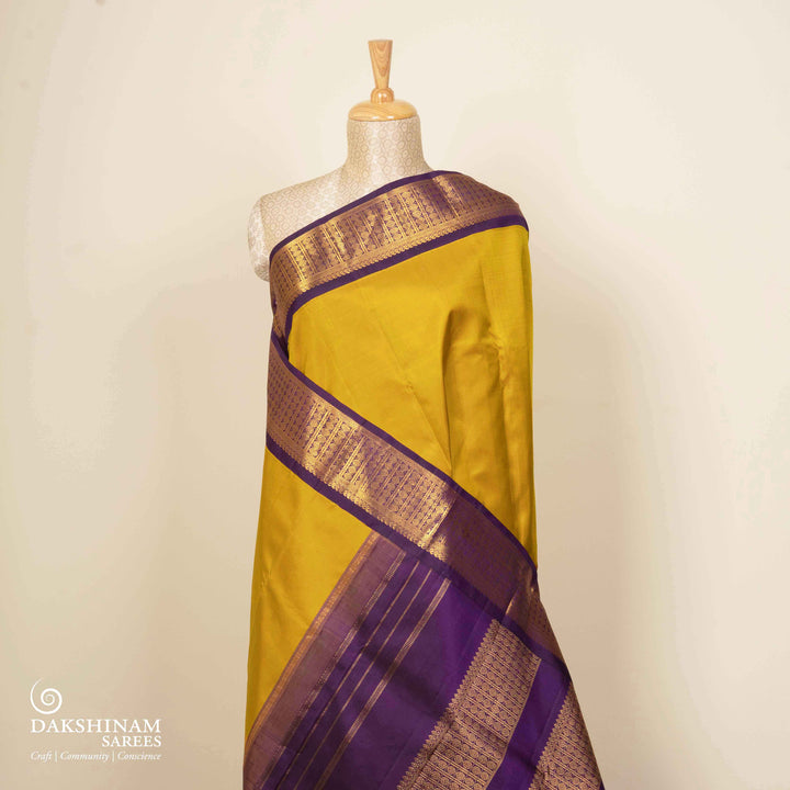 Pleats/body of Handwoven Korvai Kanjivaram silk Saree in Mustard and Purple color