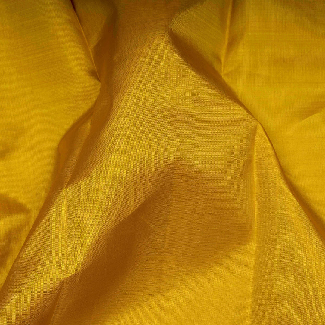 Close-up of yellow fabric with a textured pattern