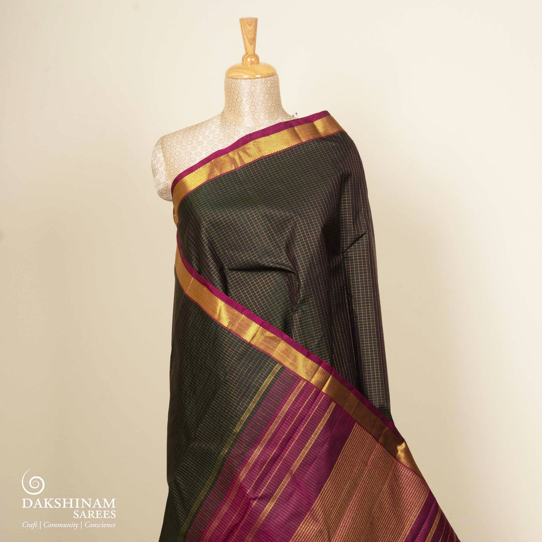 Pleats/body of Handwoven Checks & Stripes Kanjivaram silk saree in black and magenta color