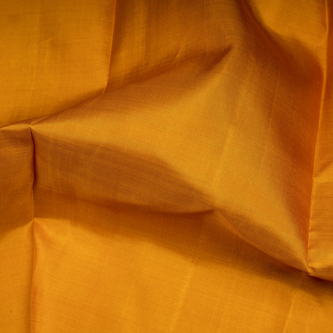 Close-up of orange fabric with folds