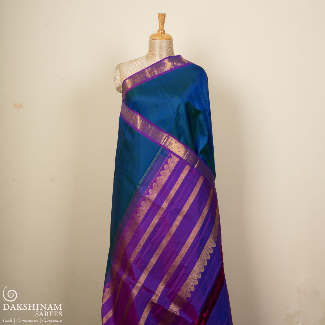 Pleats/body of Handwoven Kanjivaram silk saree in Peacock Blue and Purple color