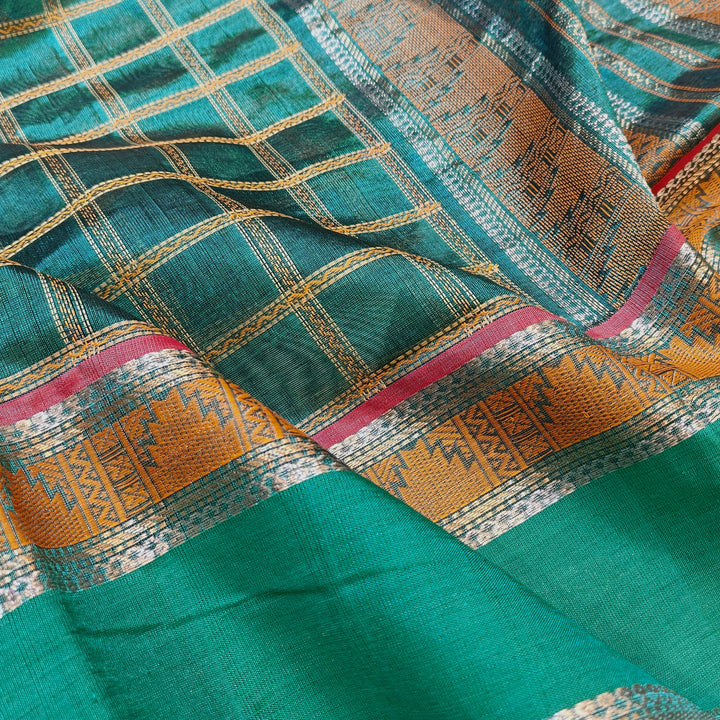 Checked dark green silk cotton saree with rettapet temple border and gold zari pallu design