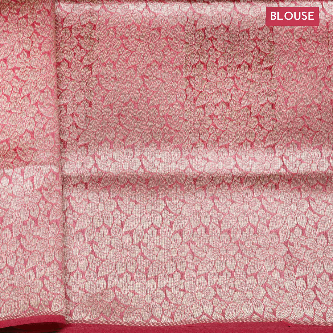 Light pink organza Banarasi silk saree with floral zari vines and zigzag patterned border