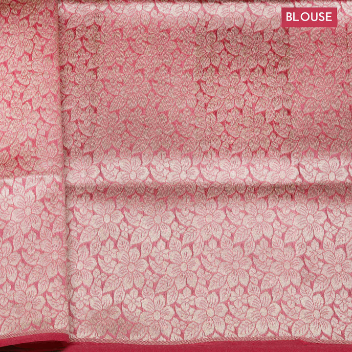 Light pink organza Banarasi silk saree with floral zari vines and zigzag patterned border