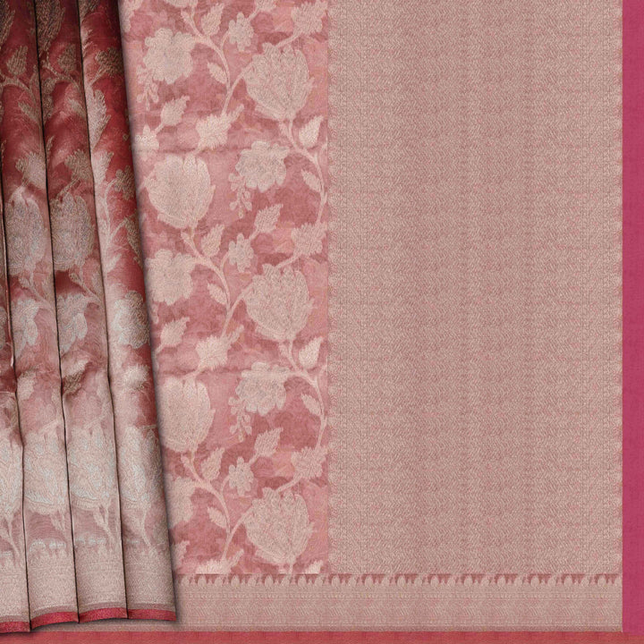 Light pink organza Banarasi silk saree with floral zari vines and zigzag patterned border