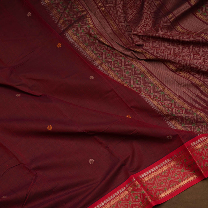Maroon Kanchi cotton saree with traditional rudraksh, temple and diamond motifs and detailed pallu design