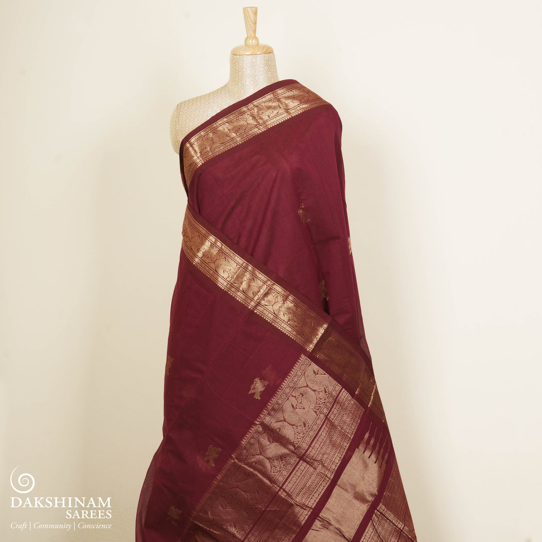 Maroon Kanchi cotton saree with kili motif body, mayil motif border and rich traditional pallu with matching blouse