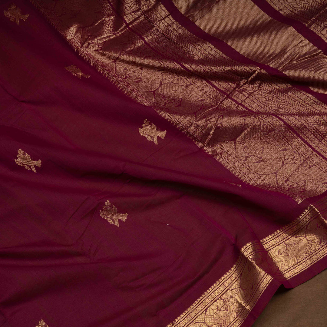 Maroon Kanchi cotton saree with kili motif body, mayil motif border and rich traditional pallu with matching blouse