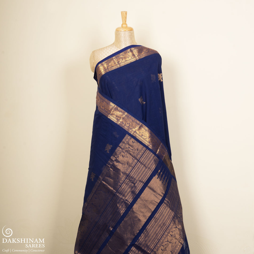Blue Kanchi cotton saree with kili motif body, mayil motif border and rich traditional pallu with matching blouse
