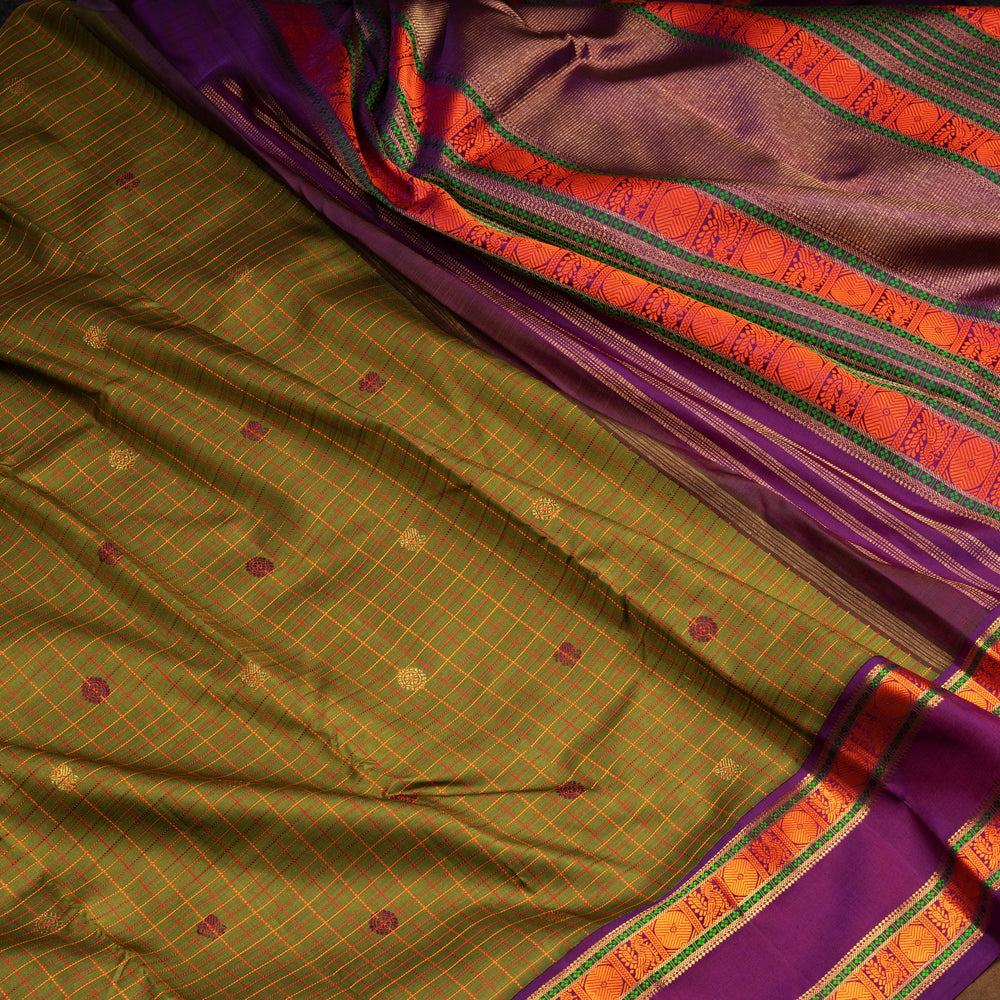 Olive green Kanjivaram silk saree with checks, annam and chakram butta, violet rettapet border and matching blouse