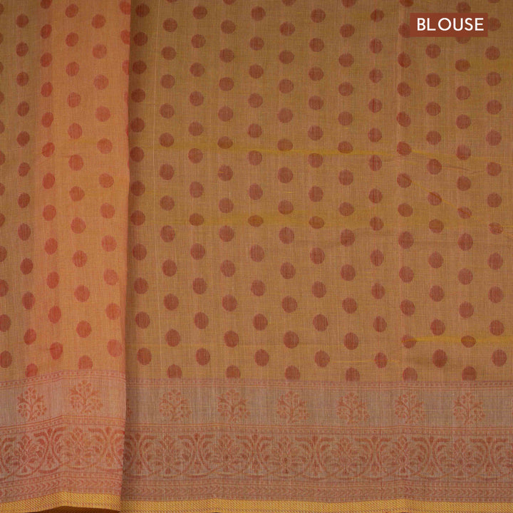 Orange South cotton saree with floral body featuring peacock, horse, elephant, deer and tiger motifs, traditional border and paisley pallu, matching blouse with dot design.