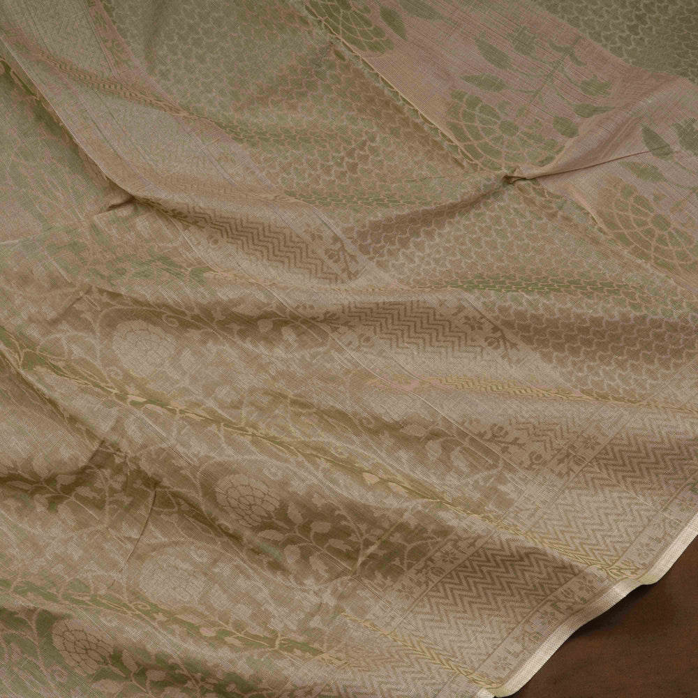 Beige South cotton saree with floral vine body pattern, vine border with chevron lines, patterned pallu and matching blouse with dot design.