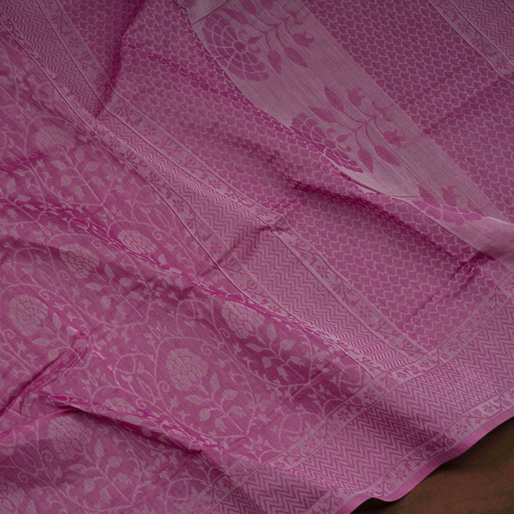 Pink South cotton saree with floral vine body pattern, vine border with chevron lines, patterned pallu and matching blouse with dot design.