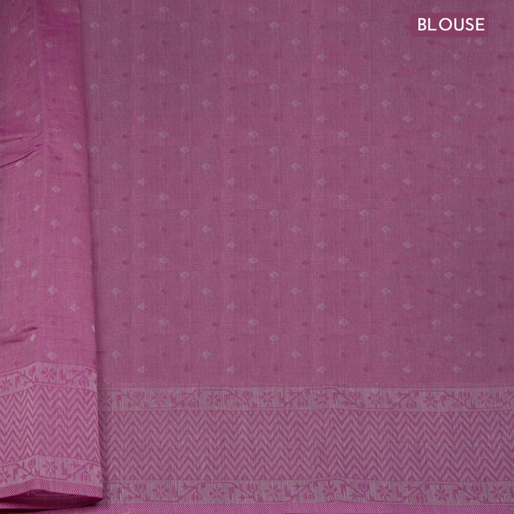 Pink South cotton saree with floral vine body pattern, vine border with chevron lines, patterned pallu and matching blouse with dot design.