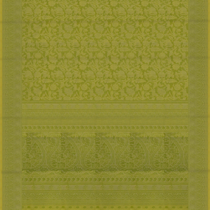 Lime green South cotton saree with floral body featuring peacock, horse, elephant, deer and tiger motifs, traditional border and paisley pallu, matching blouse with dot design.