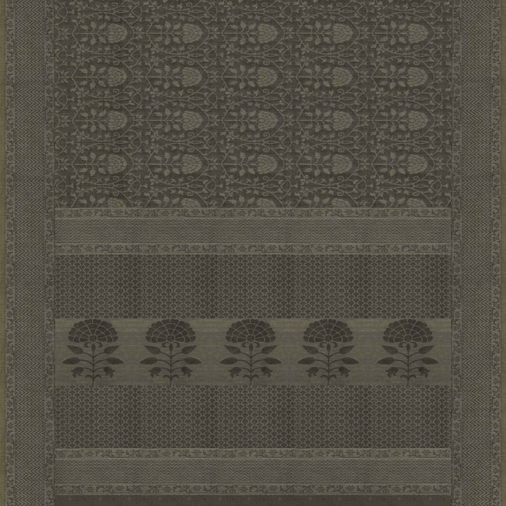 Black South cotton saree with floral vine body pattern, vine border with chevron lines, patterned pallu and matching blouse with dot design.