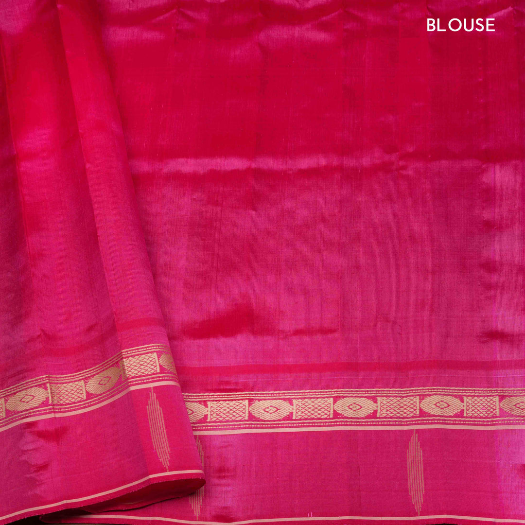 Blue Gadwal silk saree with raw silk finish body, silver stripe detailing, pink border with chakram and thazampoo motifs, pink blouse.