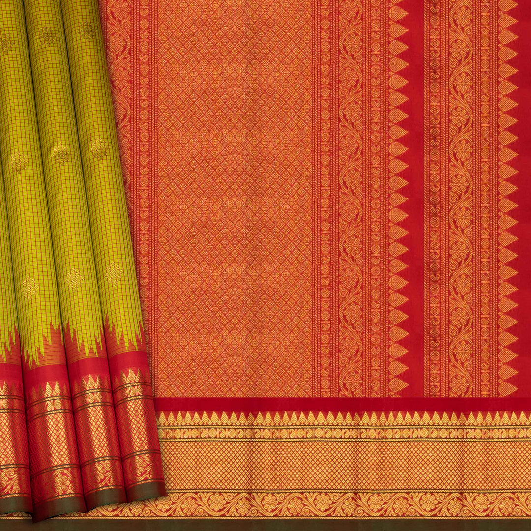 Lime green Gadwal silk saree with red check lines and small butta body, red zari border with rudraksh and mango motifs, plain red blouse.