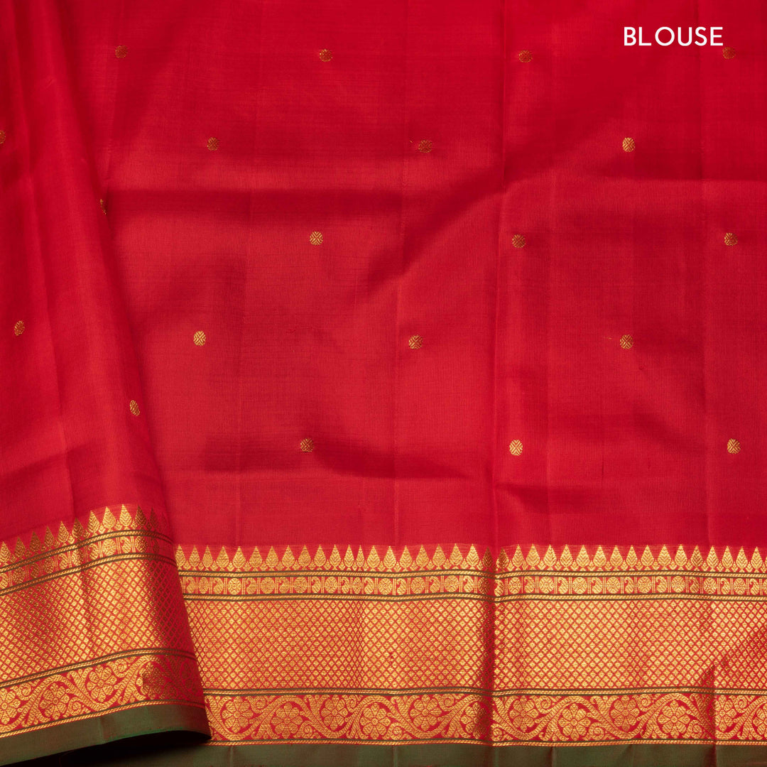 Lime green Gadwal silk saree with red check lines and small butta body, red zari border with rudraksh and mango motifs, plain red blouse.