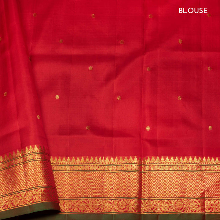 Lime green Gadwal silk saree with red check lines and small butta body, red zari border with rudraksh and mango motifs, plain red blouse.