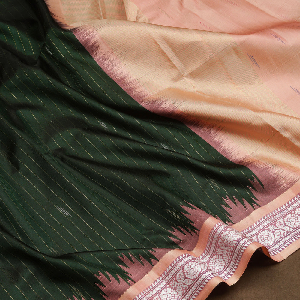 Bottle green Gadwal silk saree with gold zari stripes, peach border and temple design pallu