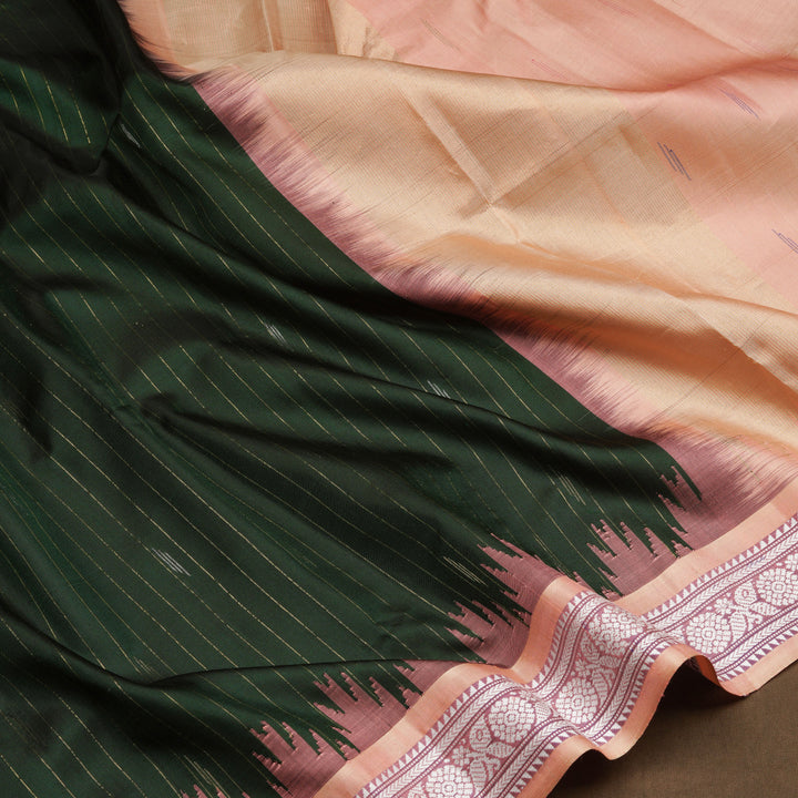 Bottle green Gadwal silk saree with gold zari stripes, peach border and temple design pallu