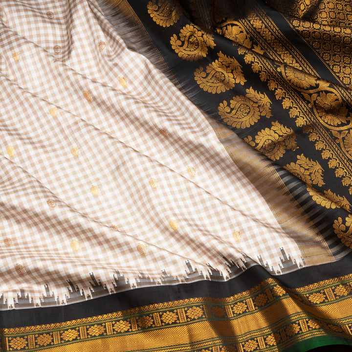 Off white Gadwal silk saree with small checks, dark green border and gold zari traditional motifs