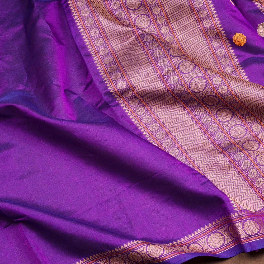 Plain violet silk cotton saree with thread woven rudraksham border and temple chakra pallu design
