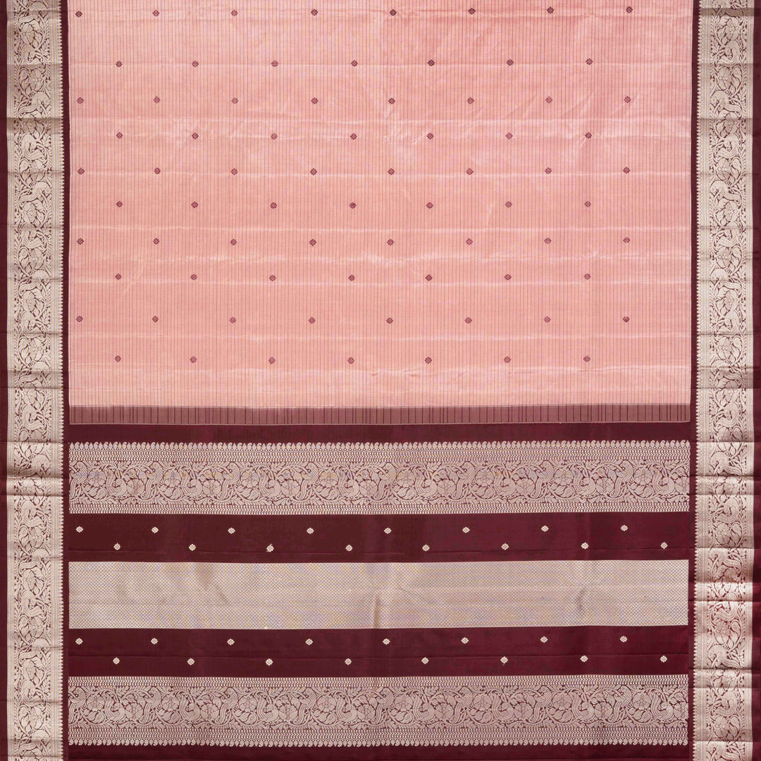 Peach handwoven Kanjivaram silk saree with horizontal stripes and chakram buttas, maroon border with parrot and floral motifs, and matching maroon blouse.