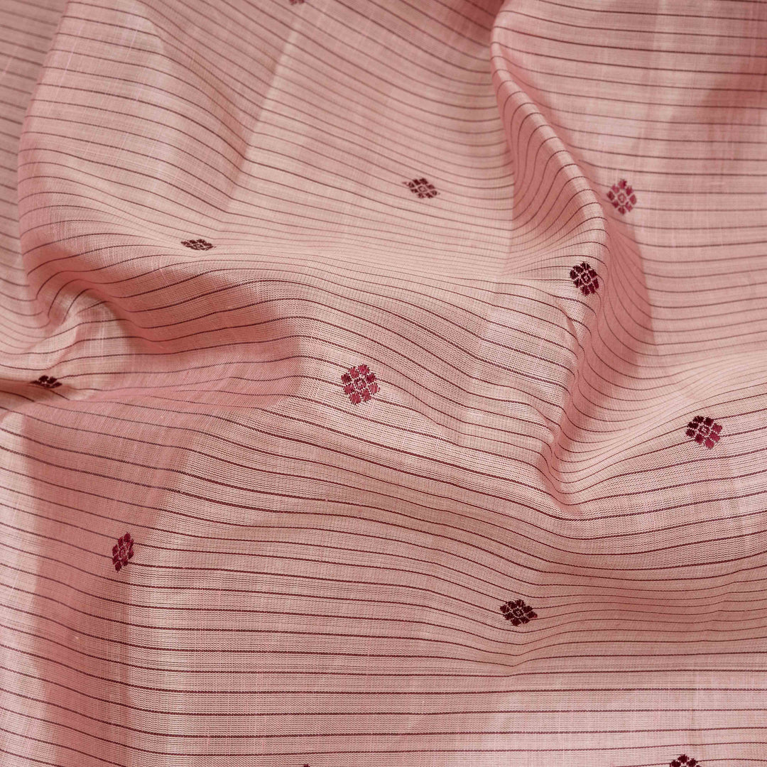 Peach handwoven Kanjivaram silk saree with horizontal stripes and chakram buttas, maroon border with parrot and floral motifs, and matching maroon blouse.