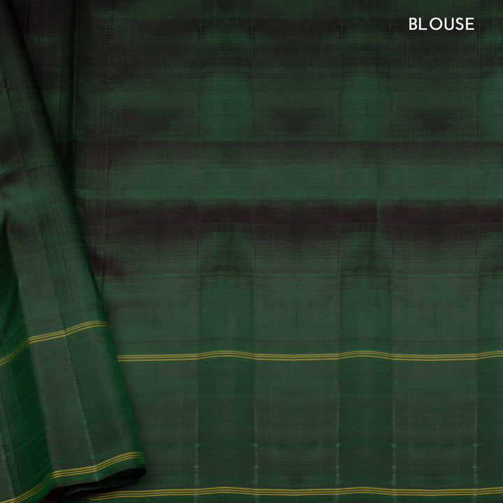 Multicolor handwoven Kanjivaram silk saree with checkered body, korvai thazampoo motifs, green rettapet border, and temple design pallu, paired with green blouse.