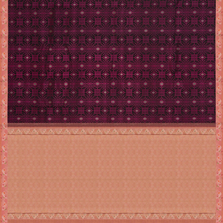 Black handwoven Kanjivaram silk saree with pink thread work, diamond and star zari motifs, peach floral meenakari border, and matching pallu, paired with peach blouse.