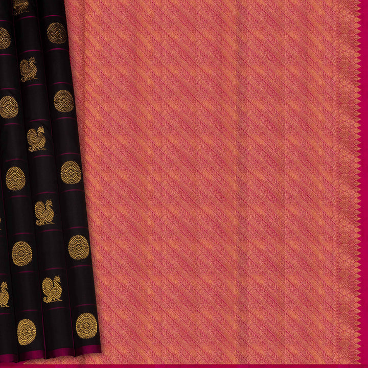 Black handwoven Kanjivaram silk saree with magenta checks, annam and chakram motifs, and pink pallu with gold zari chevron and leaf designs, paired with magenta blouse.