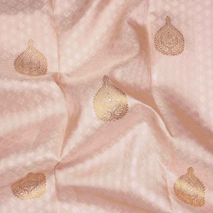 Beige handwoven Kanjivaram silk saree with self design and gold zari floral motifs, lavender border and pallu with chevron and floral patterns, paired with lavender blouse.