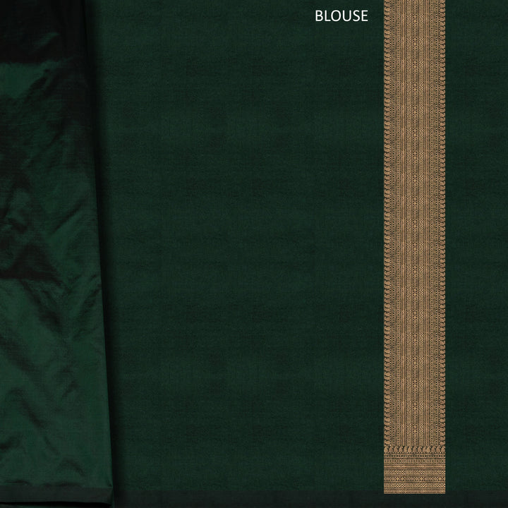 Dark green Banarasi silk saree with all-over gold brocade featuring round and diamond buttas, intricate zari border with chevron and traditional motifs, paired with a plain dark green blouse.