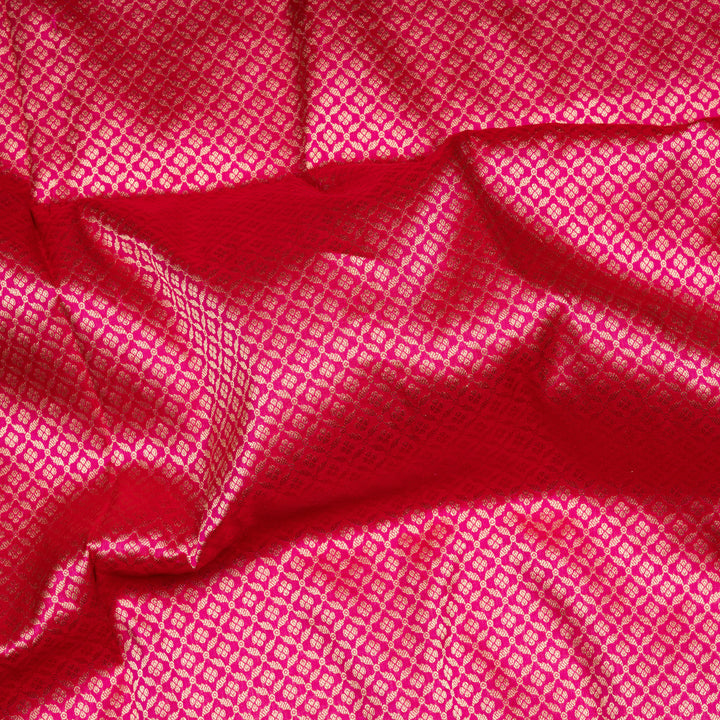 Pink Banarasi silk saree with gold brocade, diamond and vaira mookuthi buttas, paisley border with dotted and malli moggu design and matching pallu.