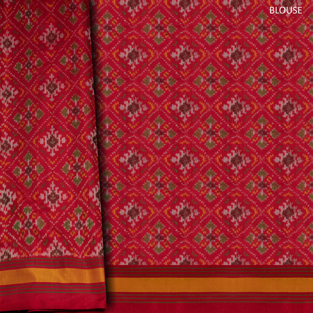 Yellow Ikat silk saree with red border accents, green and yellow border lines and red pallu with animal and human motifs, paired with red ikat blouse.