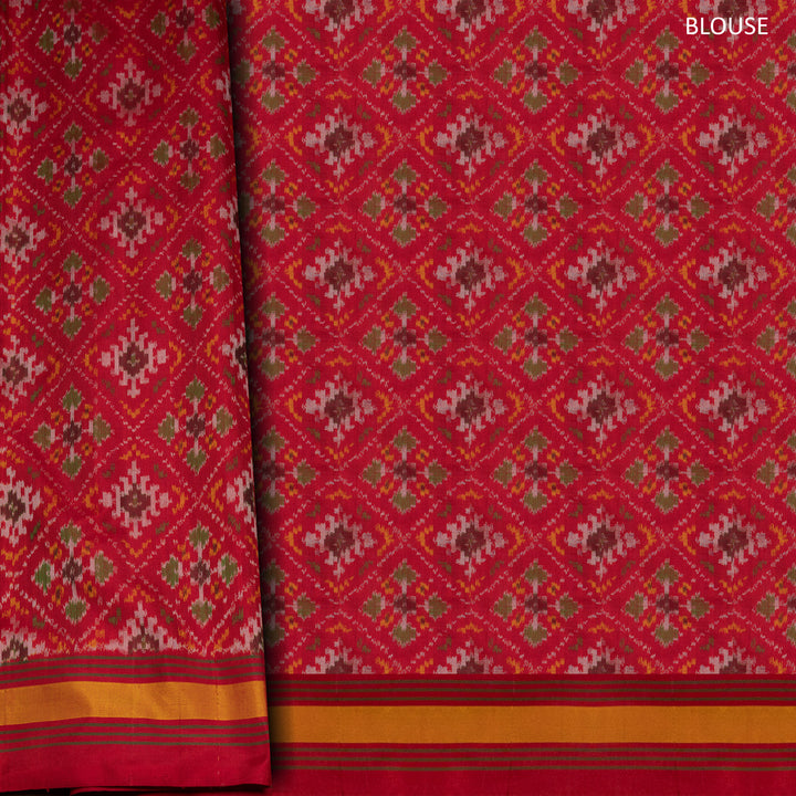 Yellow Ikat silk saree with red border accents, green and yellow border lines and red pallu with animal and human motifs, paired with red ikat blouse.
