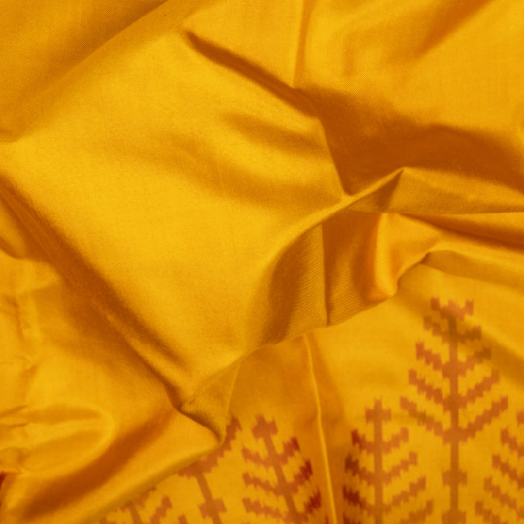 Yellow Ikat silk saree with red border accents, green and yellow border lines and red pallu with animal and human motifs, paired with red ikat blouse.