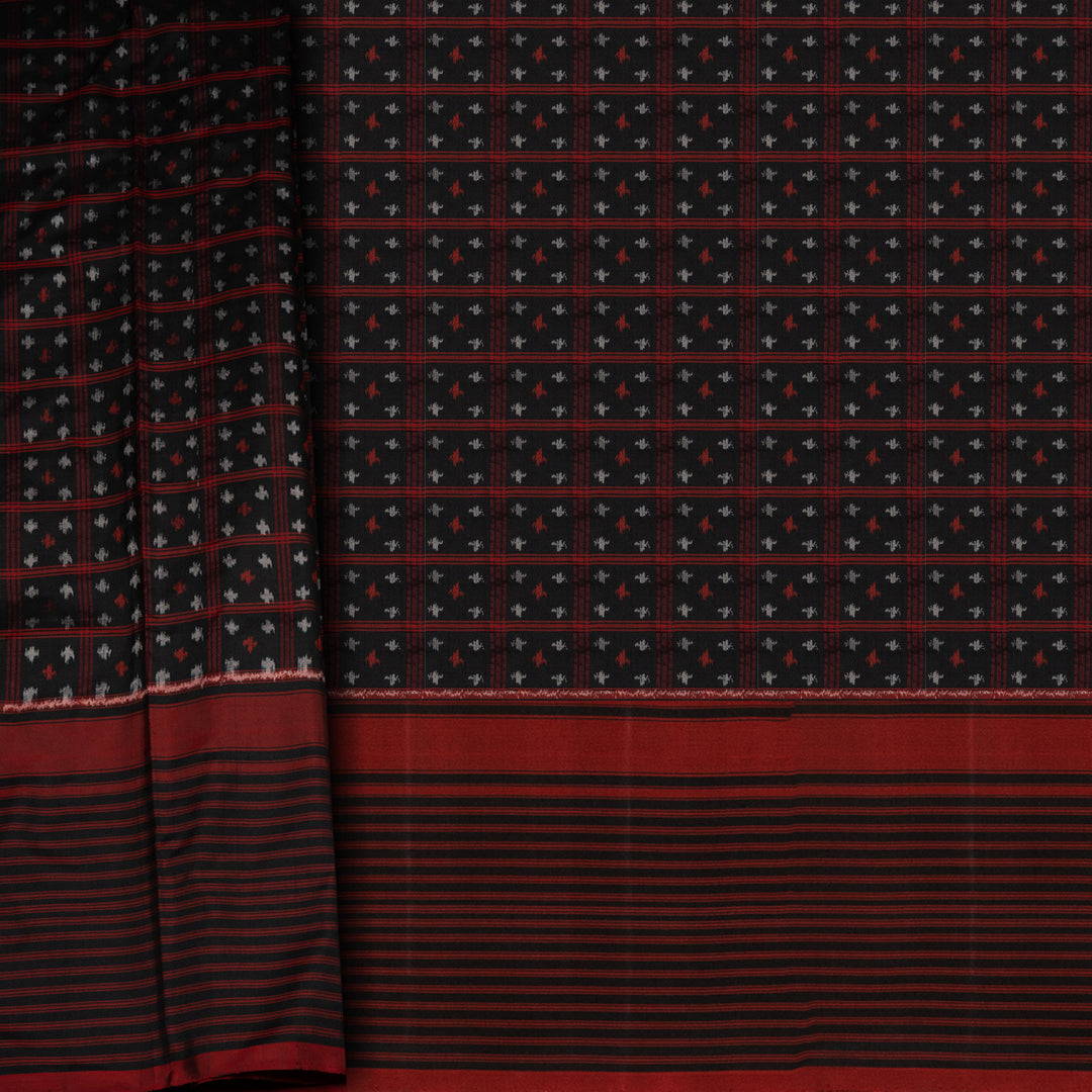 Black Pochampally Ikat silk saree with ikat checks, kadiyal butta, black border with red panel and rectangular patterns, paired with off-white ikat blouse.