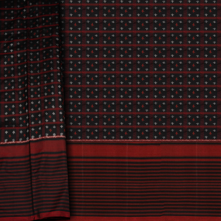 Black Pochampally Ikat silk saree with ikat checks, kadiyal butta, black border with red panel and rectangular patterns, paired with off-white ikat blouse.