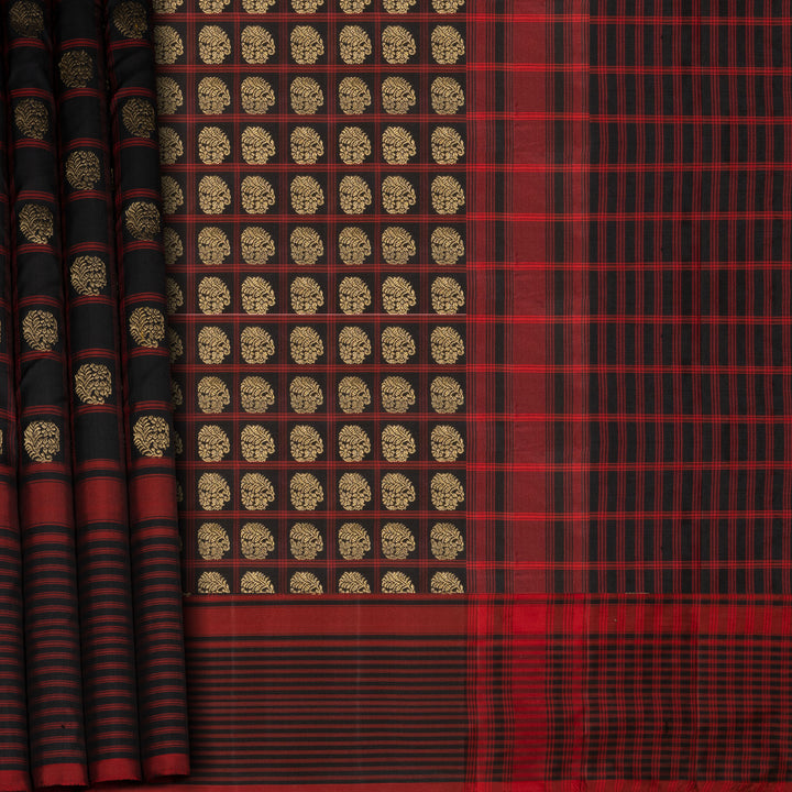 Black Pochampally Ikat silk saree with ikat checks, kadiyal butta, black border with red panel and rectangular patterns, paired with off-white ikat blouse.