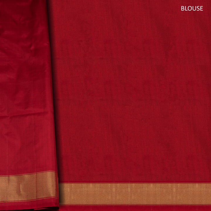 Red Pochampally Ikat silk saree with diamond motifs, red and gold zari border, and temple design pallu with arrow patterns, paired with plain red blouse with zari border.