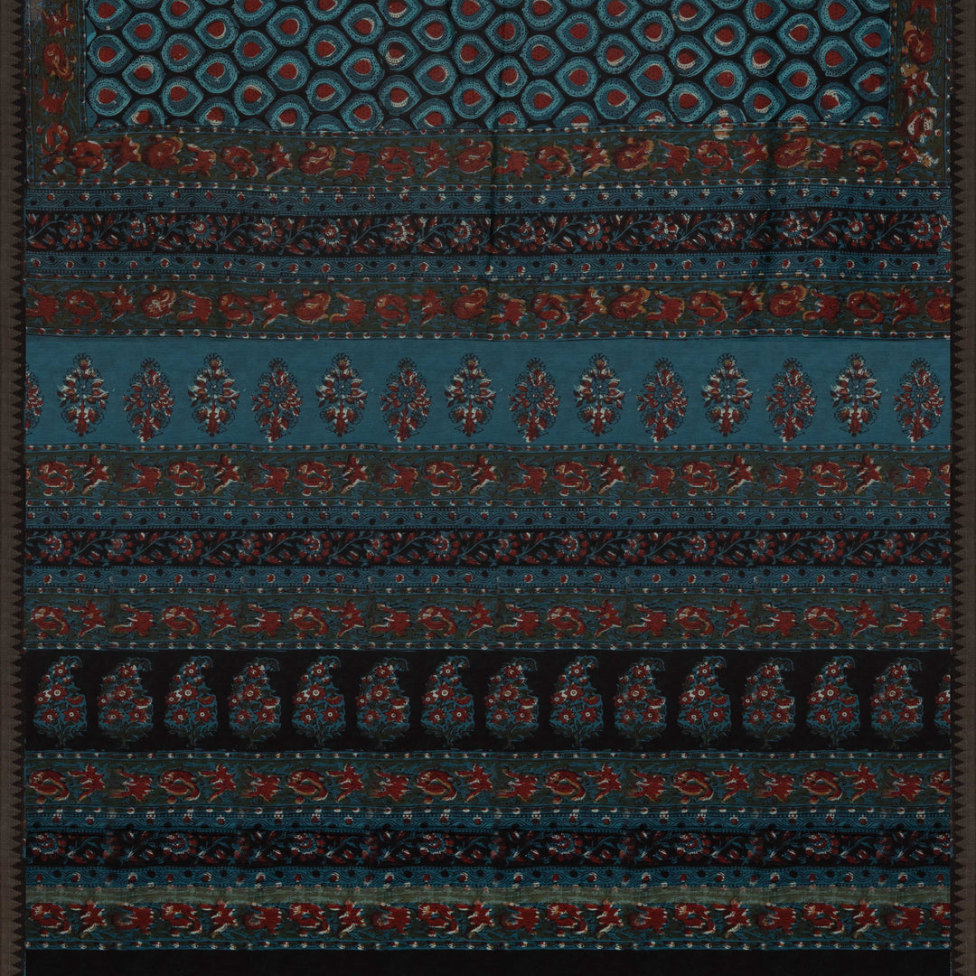 Blue handwoven Chanderi silk saree with Ajrakh print, gicha temple border, floral pallu design, paired with light blue blouse with chevron lines.