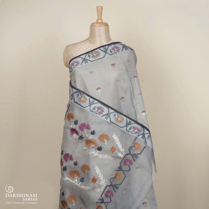 Grey Kota doria silk saree with silver zari floral butta, floral pallu and vine border with matching blouse