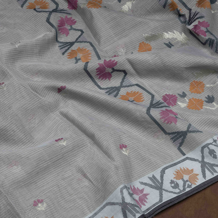 Grey Kota doria silk saree with silver zari floral butta, floral pallu and vine border with matching blouse
