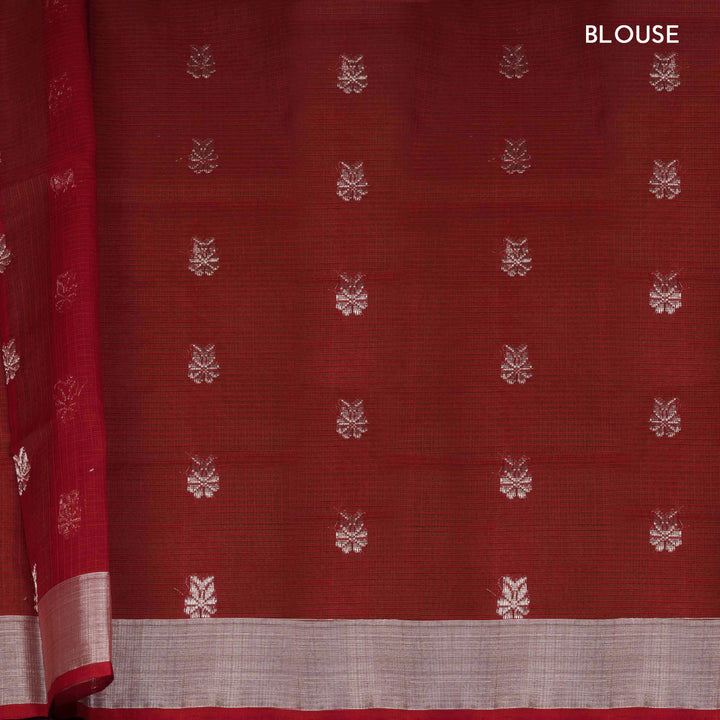 Lime yellow Kota doria silk saree with silver zari floral lines, chevron pallu and panel border with red blouse
