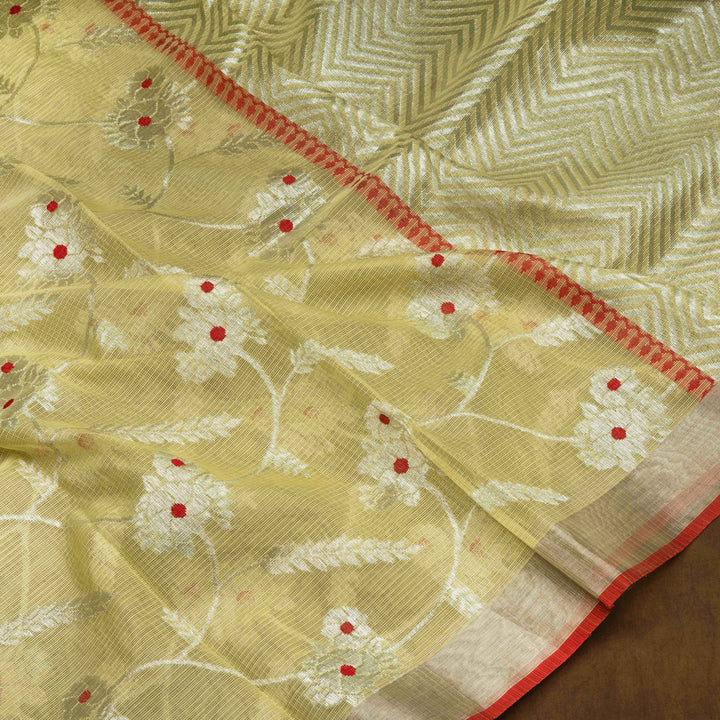 Lime yellow Kota doria silk saree with silver zari floral lines, chevron pallu and panel border with red blouse