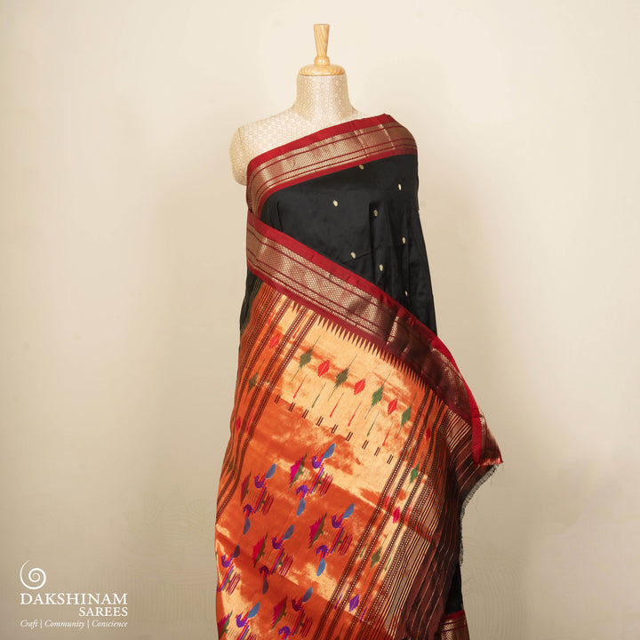 Black silk Paithani saree with mango butta, diamond zari border and bird Paithani pallu with paneled lines and matching blouse